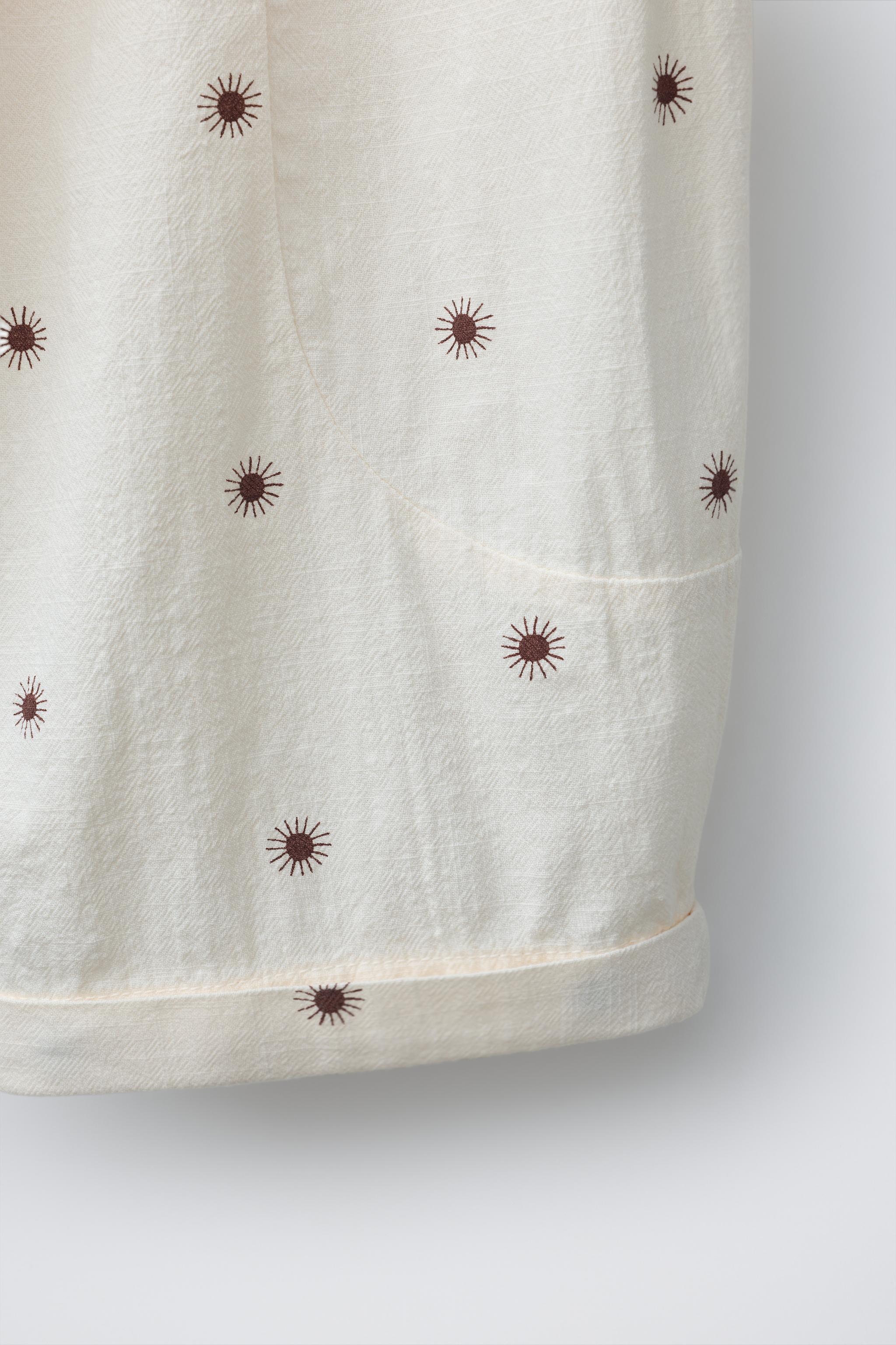 TEXTURED SUN PRINT BAGGY PANTS